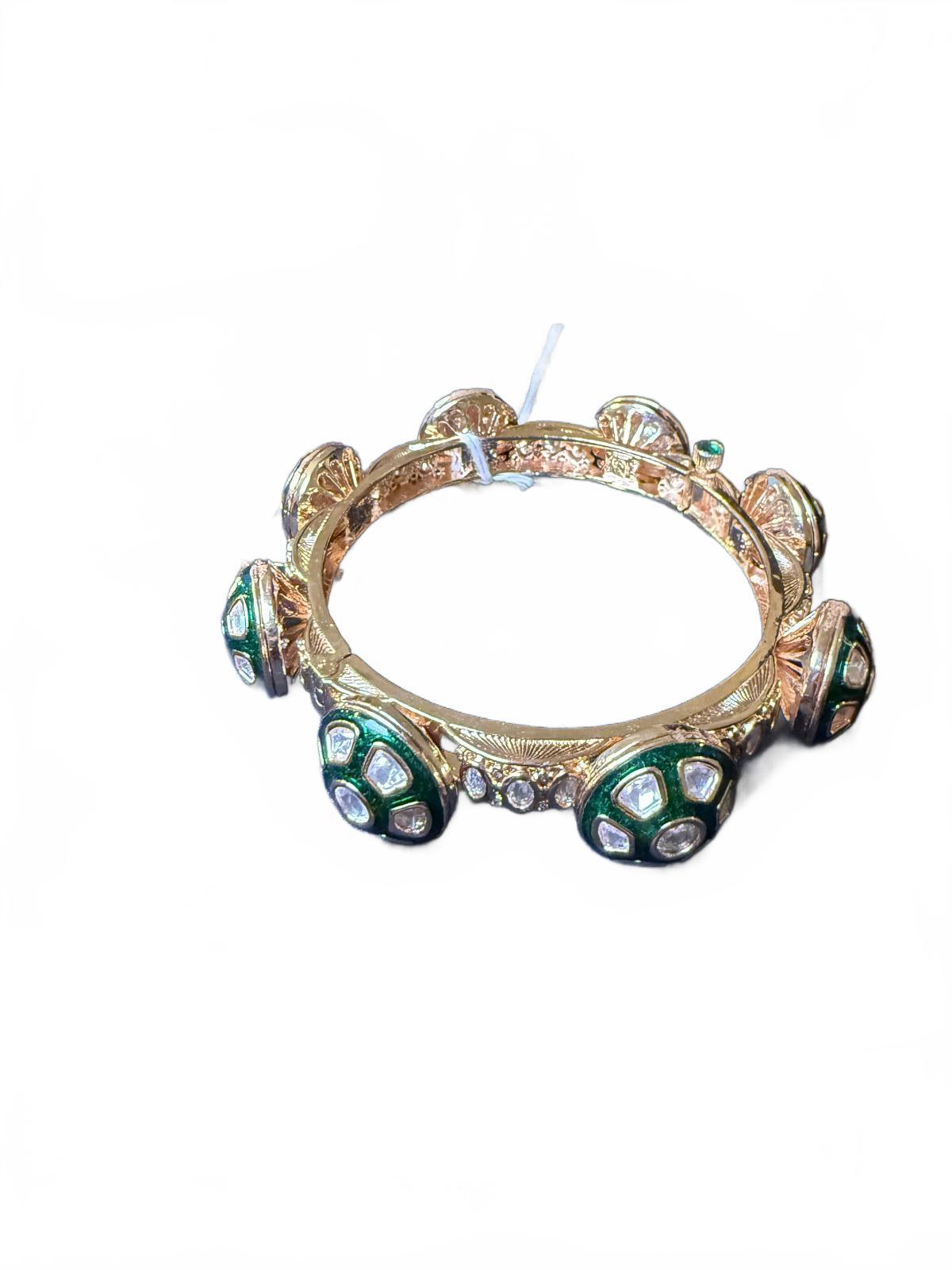 Gold Tone Bangle Bracelet with Green and Clear Stone Accents