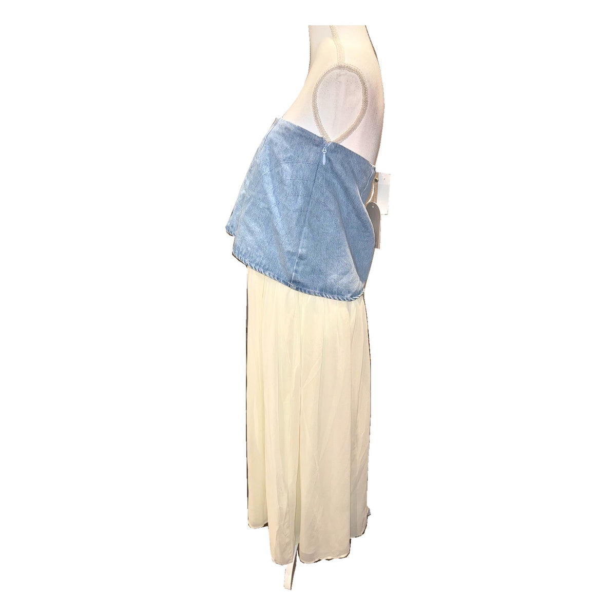 Side of the MESHKI Tully skirt displayed on a mannequin, showing the blue denim panel and long ivory chiffon.
