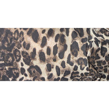 Close-up of tan, brown and black leopard-print fabric with subtle sparkle on the Essentiel Antwerp dress.