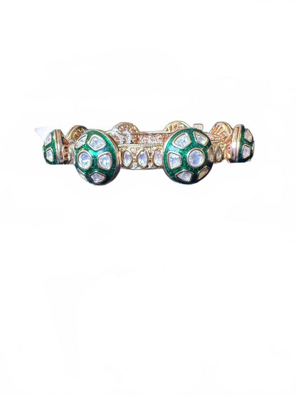 Gold Tone Bangle Bracelet with Green and Clear Stone Accents
