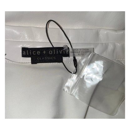 Alice + Olivia Classics label with XL/TG size tag, Made in China label, spare button and attached tag fastener.