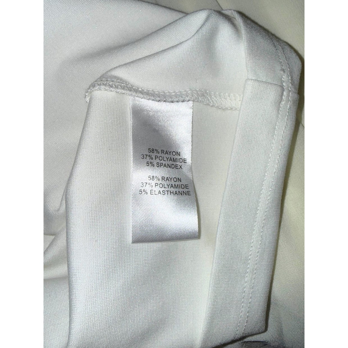 MILLY fabric label listing 58% rayon, 37% polyamide and 5% spandex.