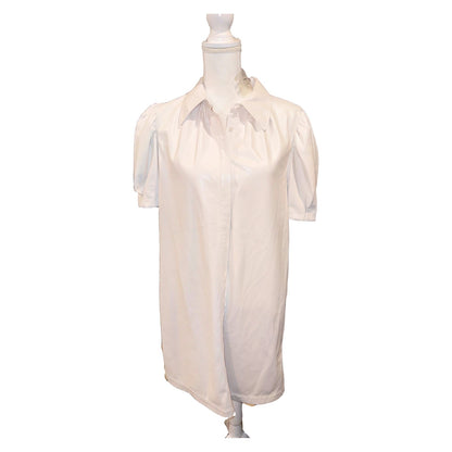 Front of the ivory Alice + Olivia faux leather shirtdress with pointed collar, concealed placket and puff sleeves.
