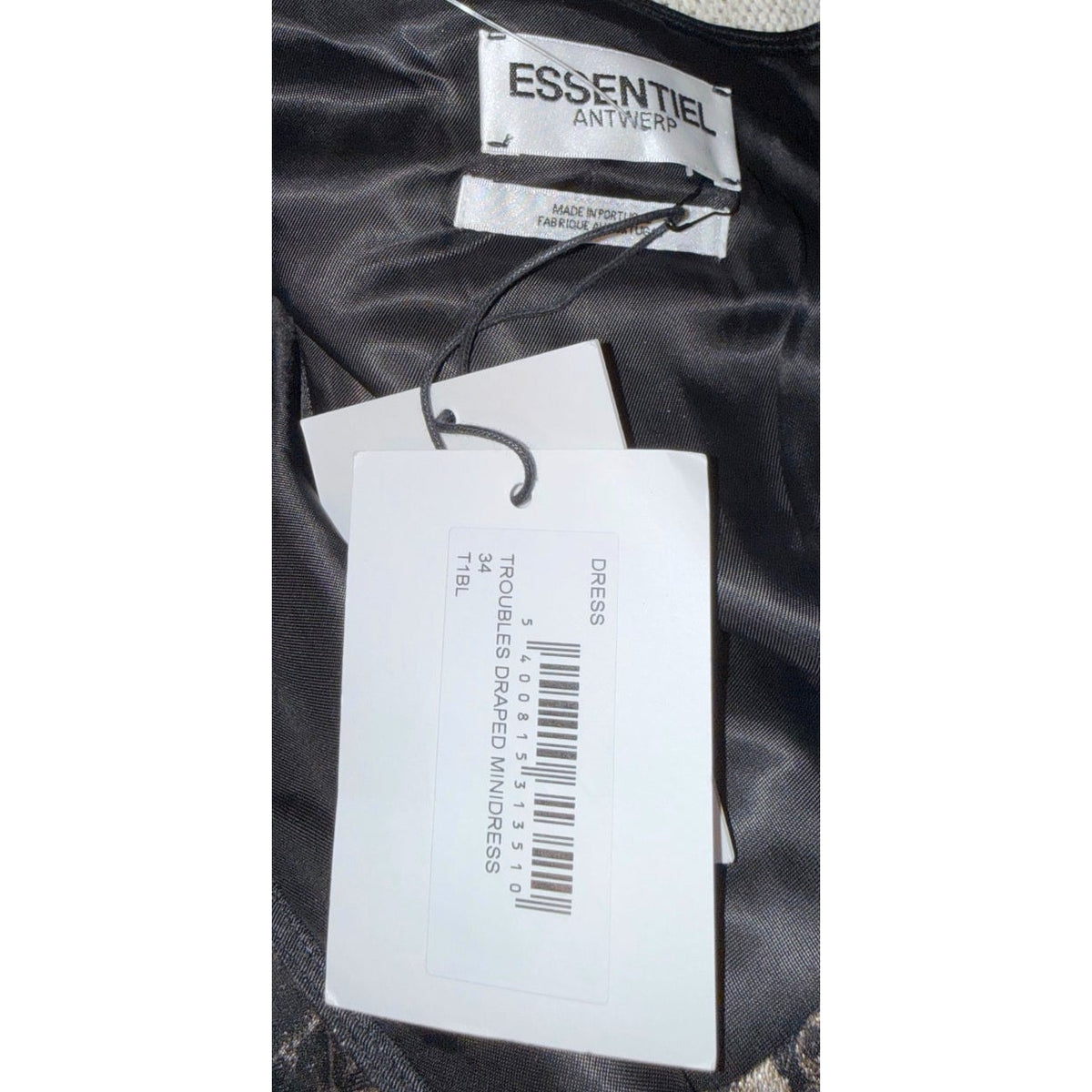Essentiel Antwerp brand label and attached Troubles Draped Minidress hangtag inside the dress.
