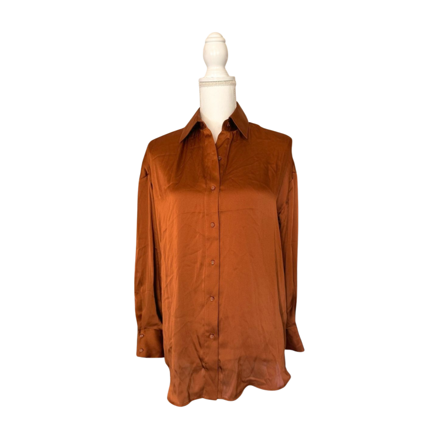 Brown shirt on a mannequin against a white background