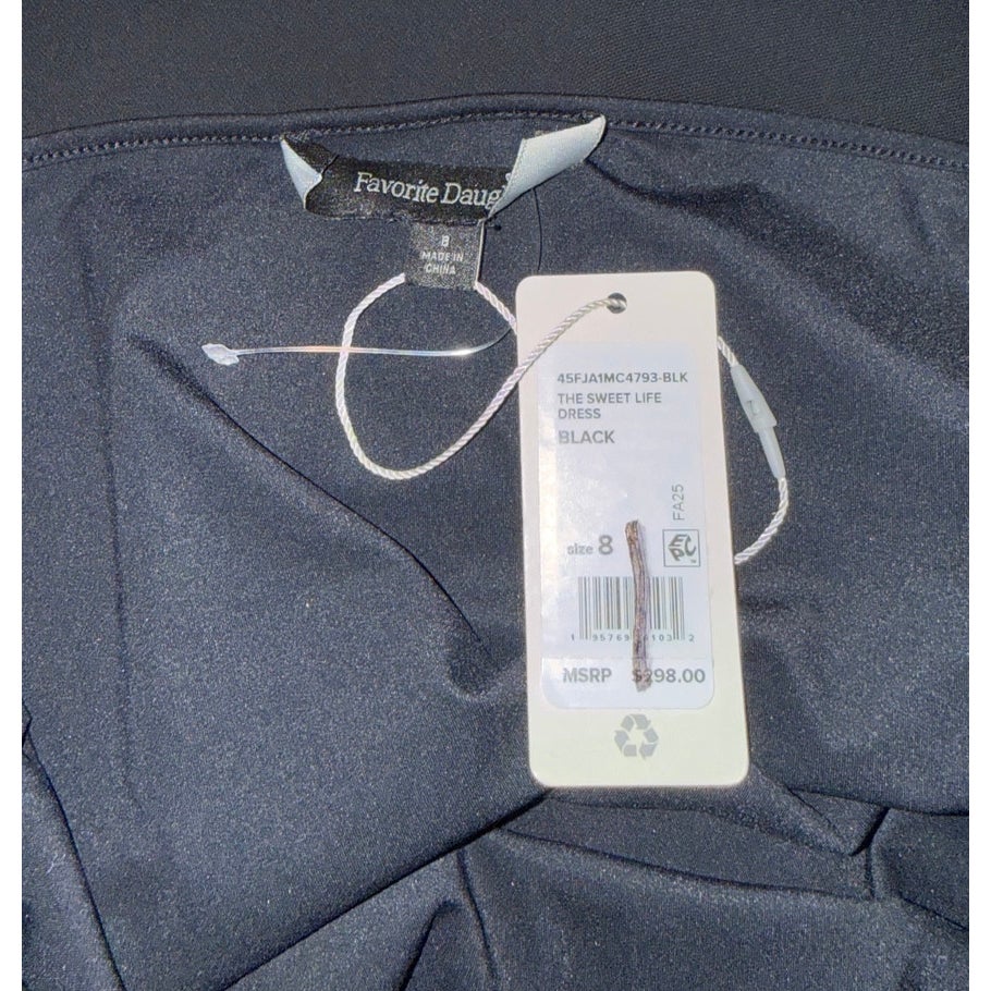 Favorite Daughter brand label and Sweet Life Dress hangtag marked black, size 8.