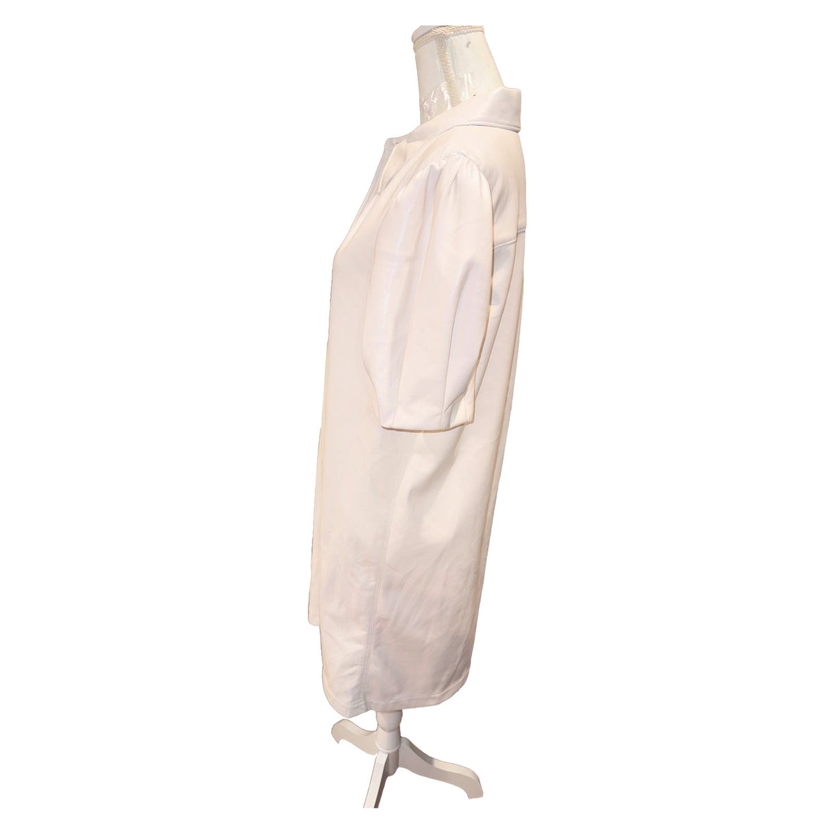Side view of the ivory Alice + Olivia shirtdress, showing the short puff sleeve and straight silhouette.