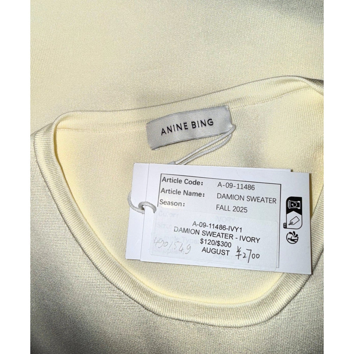 ANINE BING label and Damion Sweater ivory hangtag marked Fall 2025 and article code A-09-11486-IVY1.