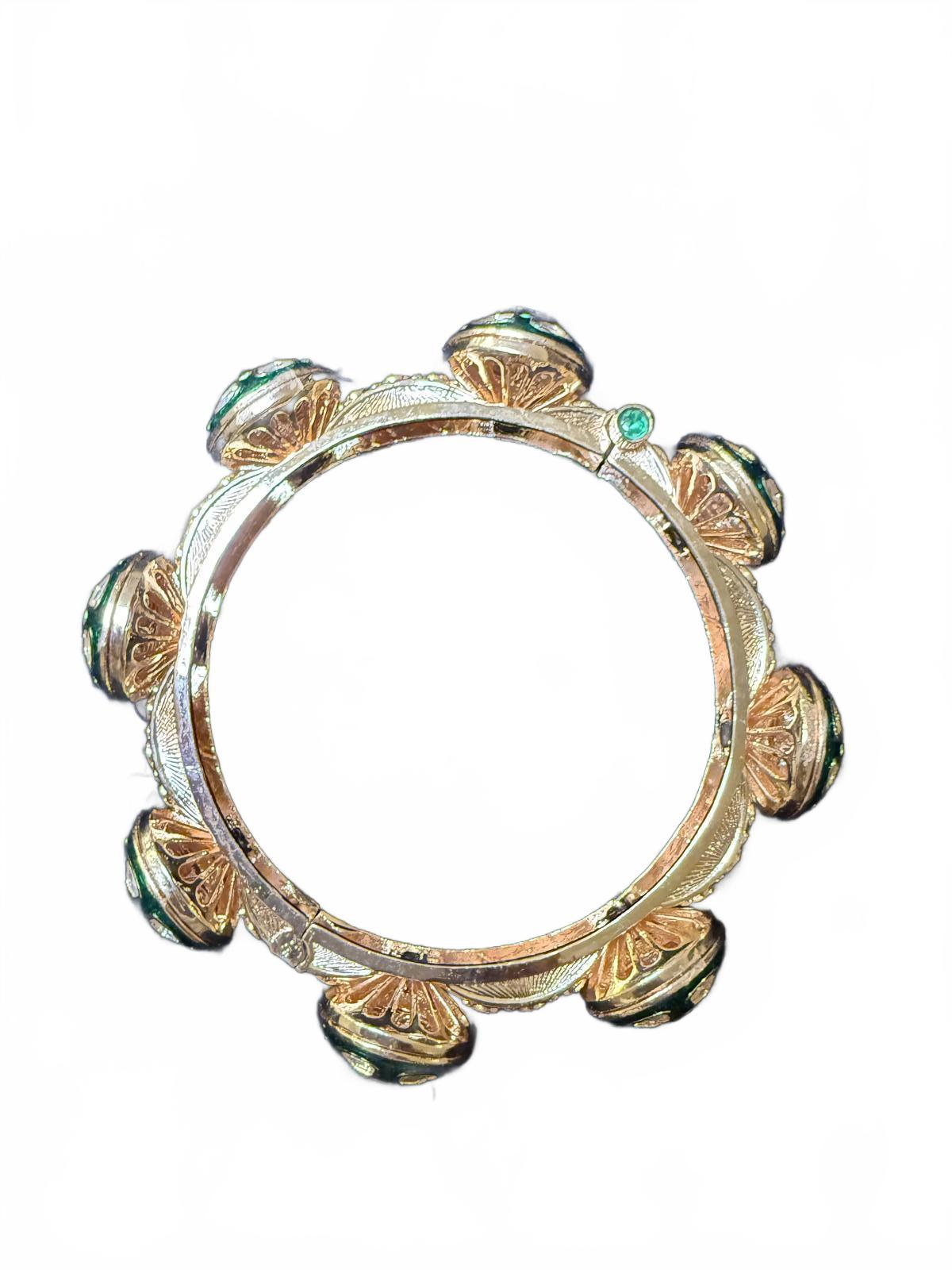 Gold Tone Bangle Bracelet with Green and Clear Stone Accents