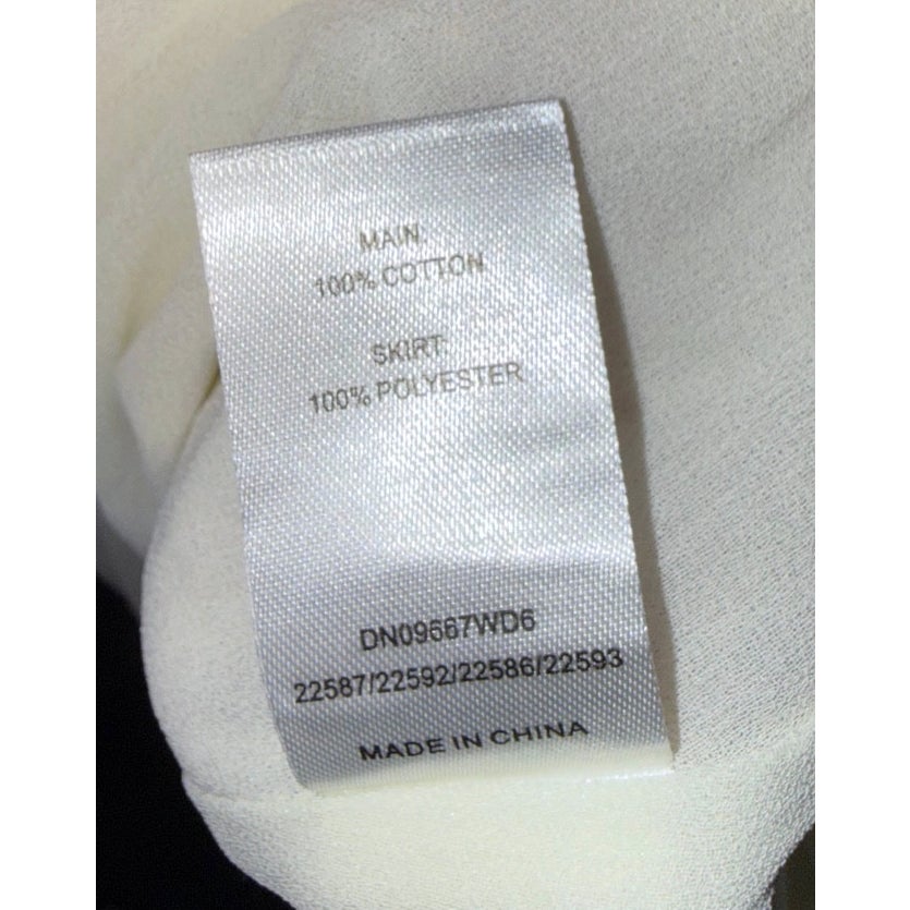 MESHKI composition label: main 100% cotton, skirt 100% polyester; made in China.