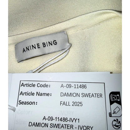 Close-up of ANINE BING label and hangtag showing Damion Sweater, Fall 2025 and article code A-09-11486.