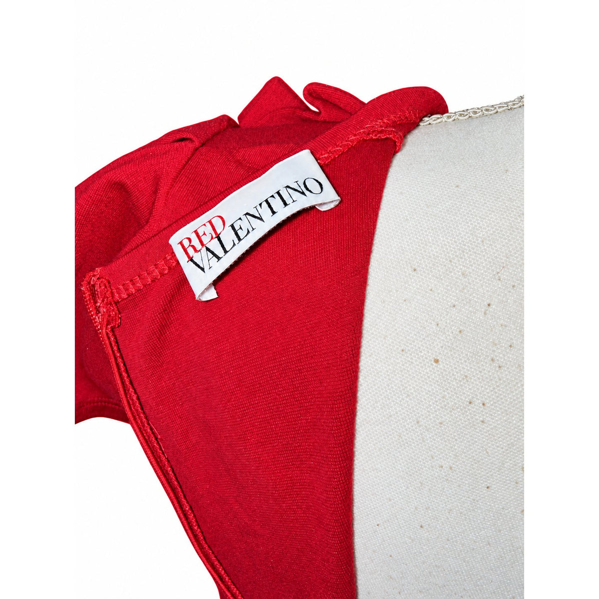 RED Valentino brand label inside the reddish-pink dress near the zipper.