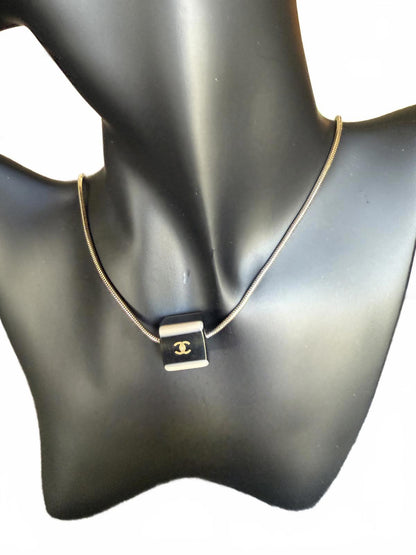 Chanel Gold Tone Necklace with Black Cube Pendant