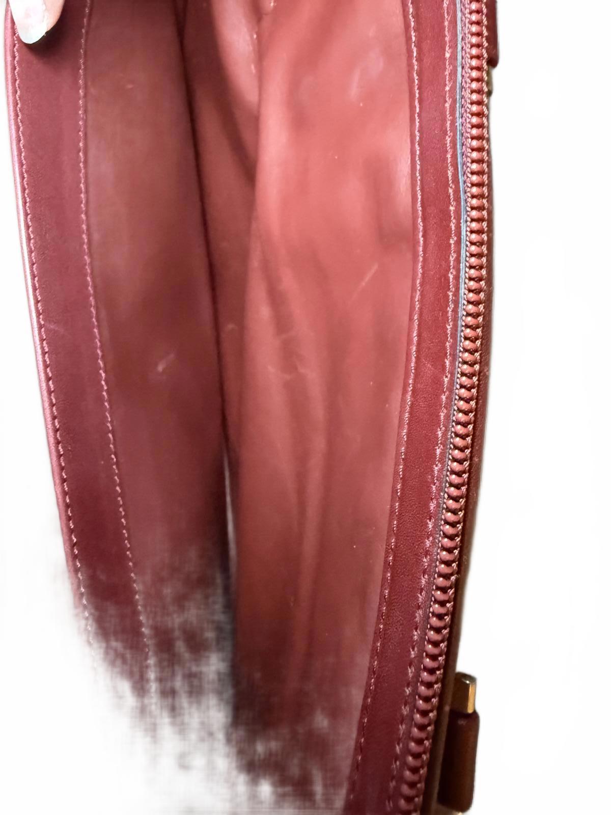 Cartier a Must De Cartier Bordeaux leather briefcase.