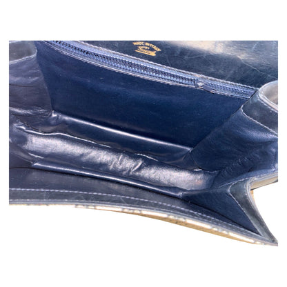 Inside the Gucci shoulder bag, showing the blue lining, interior zip pocket and visible creasing.
