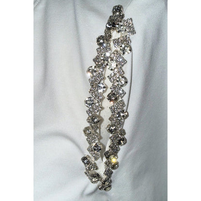 Close-up of clear faceted stones and silver-tone embellishments along the MILLY T-shirt shoulder.