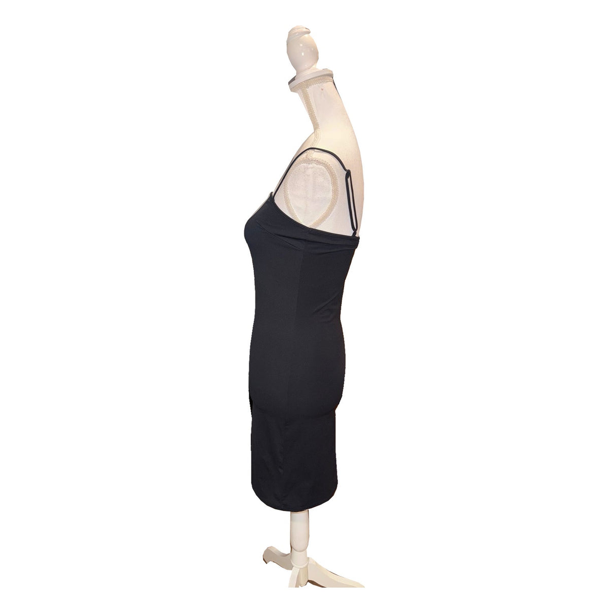 Side view of the black Favorite Daughter slip dress, showing thin straps and close-fitting silhouette.