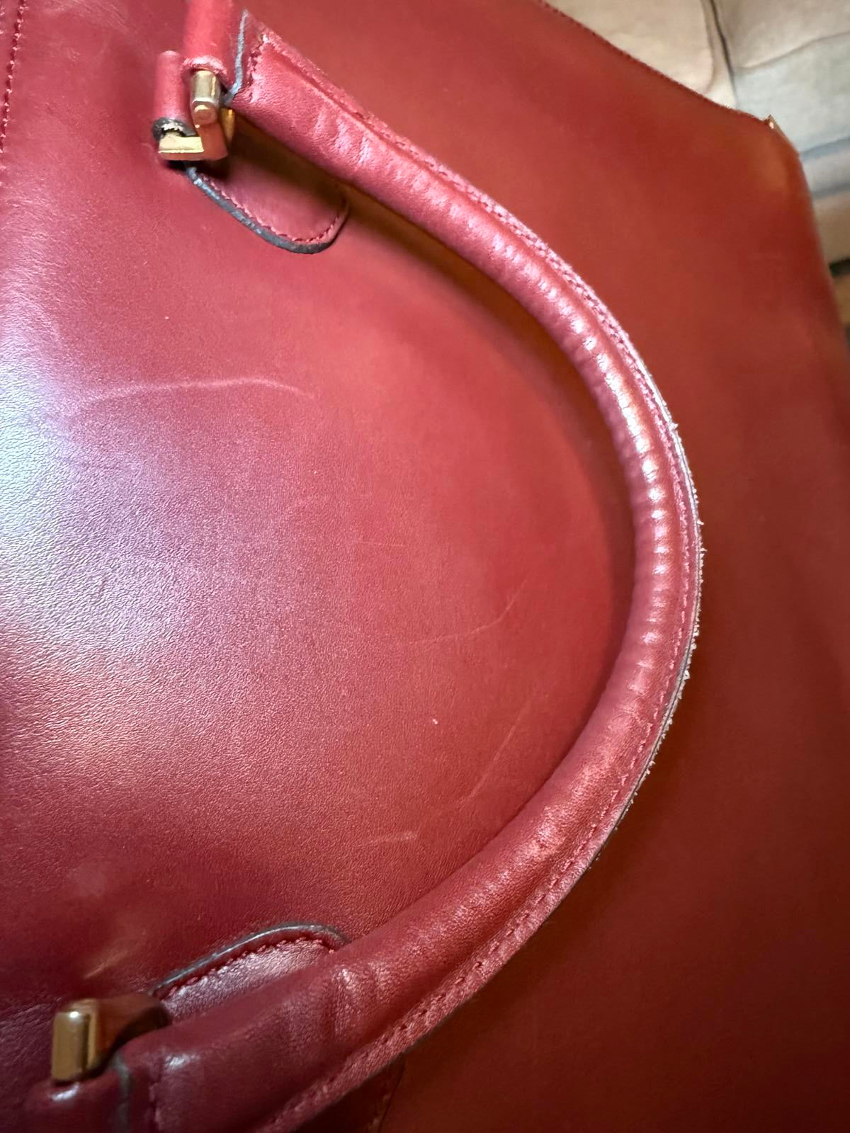 Cartier a Must De Cartier Bordeaux leather briefcase.