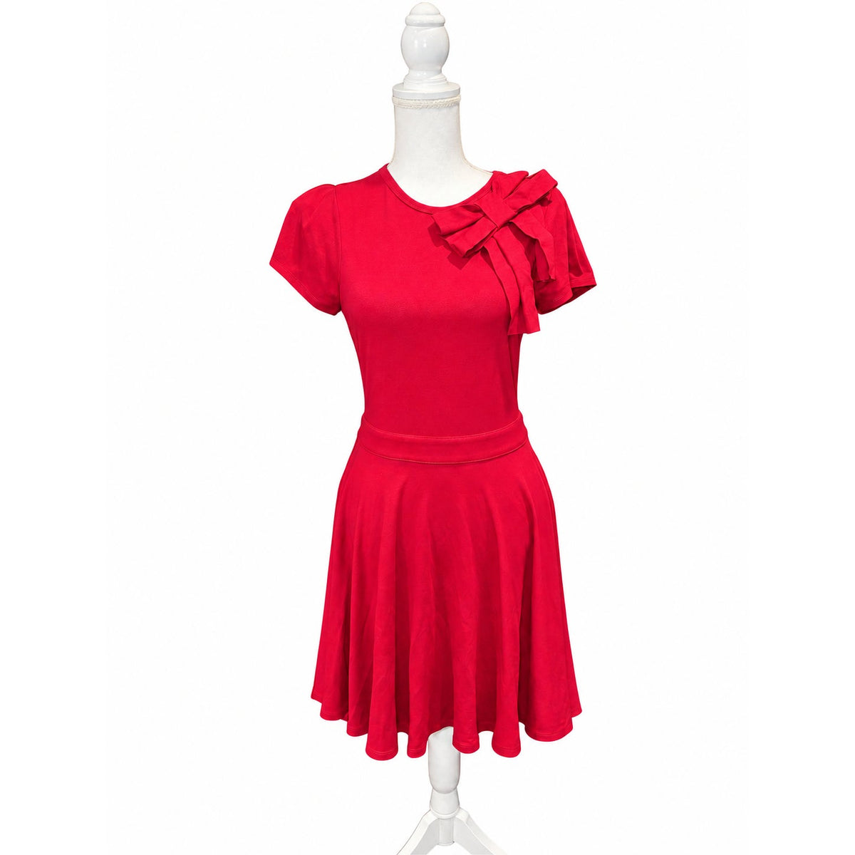 Front of the reddish-pink RED Valentino fit-and-flare dress with short sleeves and a large shoulder bow.