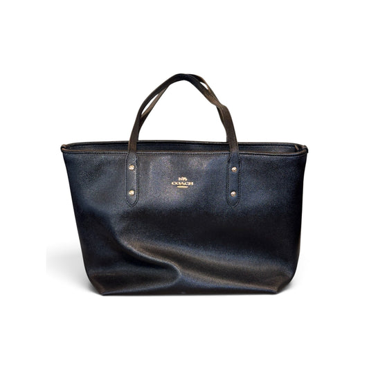 Coach black textured tote bag with double handles and gold-tone logo hardware
